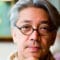 Ryuichi Sakamoto gazes pensively at the camera