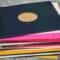 a multicolored stack of vinyl records