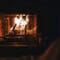 a cozy looking fireplace at night