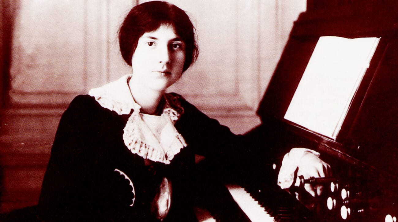 A young Lili Boulanger sits at the organ