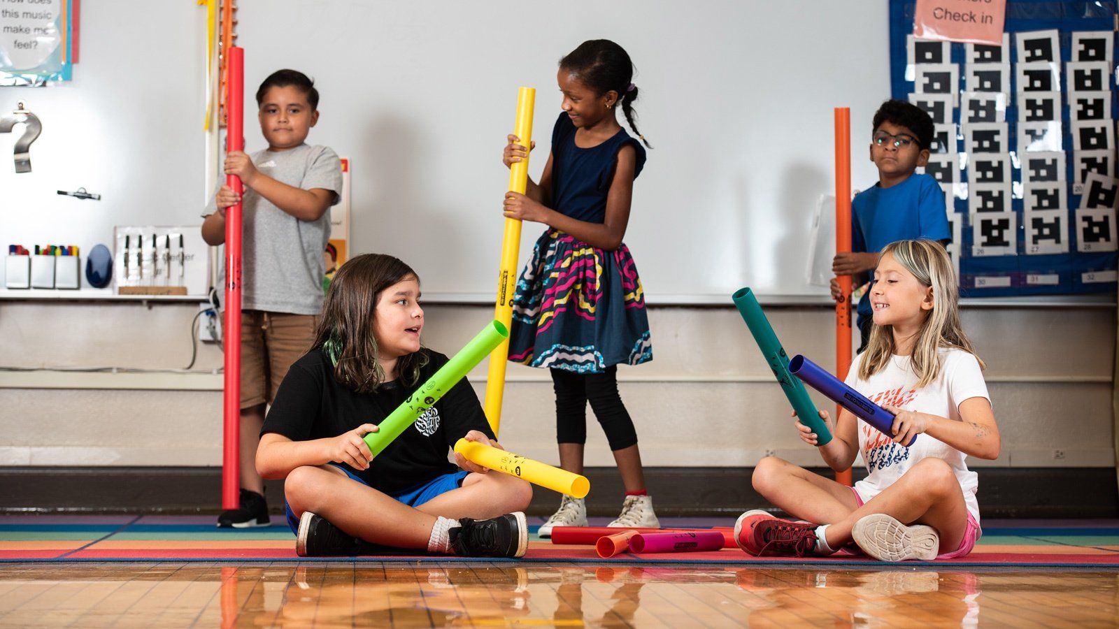 Kids plating with boomwhackers