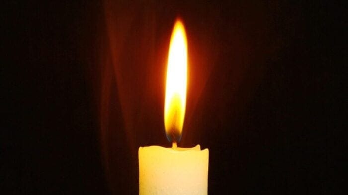 a single candle illuminated