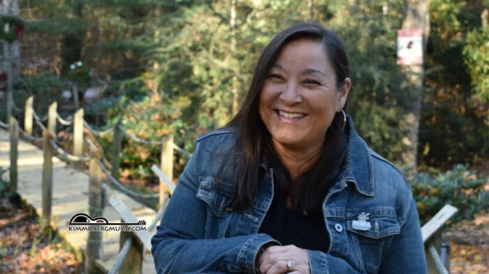 smiling woman on a board walk