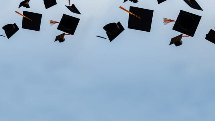 Graduation caps in the sky