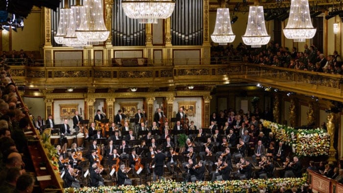 The Vienna Philharmonic performing its customary New Year's Day Concert in a dazzlingly adorned concert hall