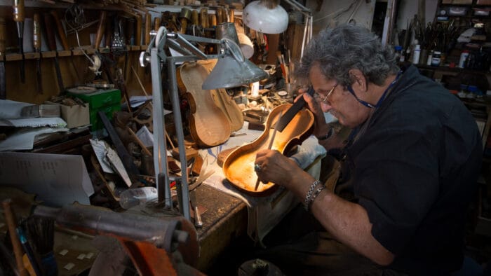 Amnon Weinstein at work repairing a violin