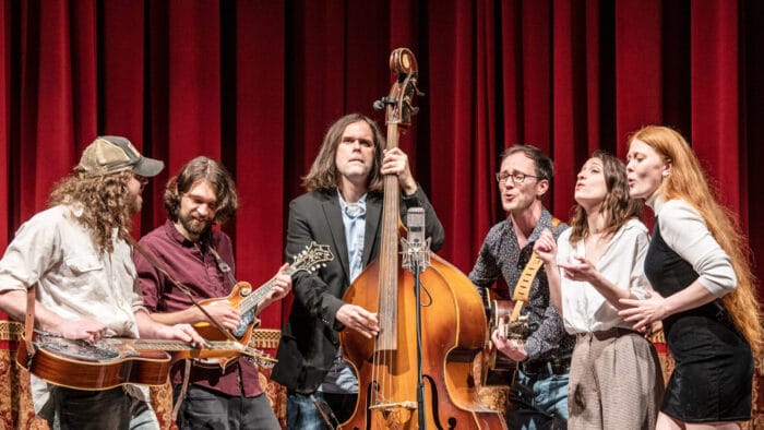 six-person string band performing on stage