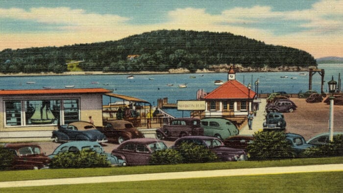 Bar Harbor Maine waterfront with vintage cars in foreground