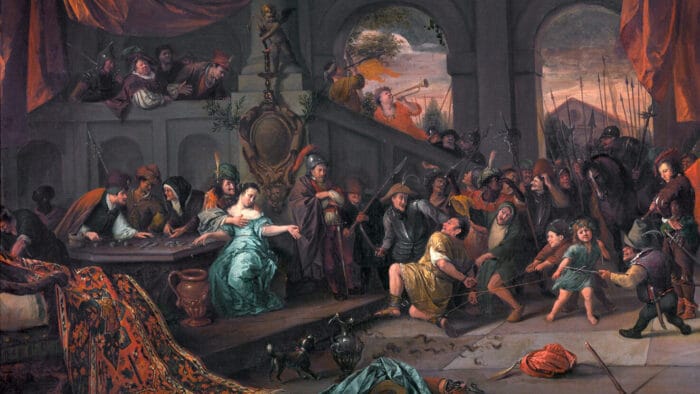 Samson, shorn and bound by the Philistines, kneels in a large hall of stone, with men, women, and children wih expressions of laughter and derision.
