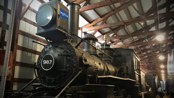 antique locomotive engine in train barn