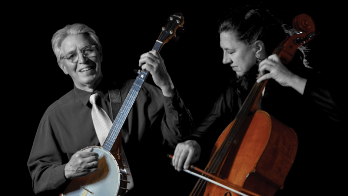 man plays banjo and woman bows cello