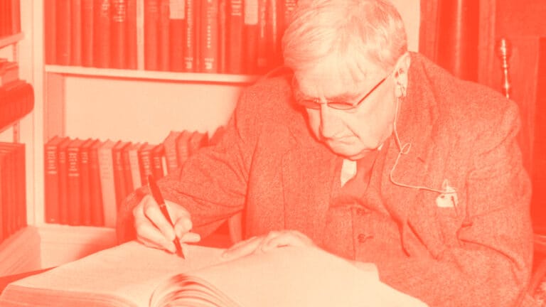 Red and white edited photograph of Vaughan Williams working on a score