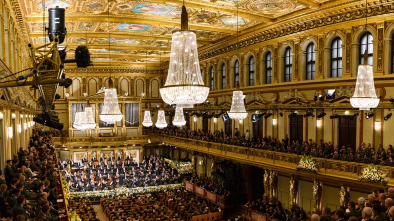 The Vienna Philharmonic performing its customary New Year's Day Concert in a dazzlingly adorned concert hall