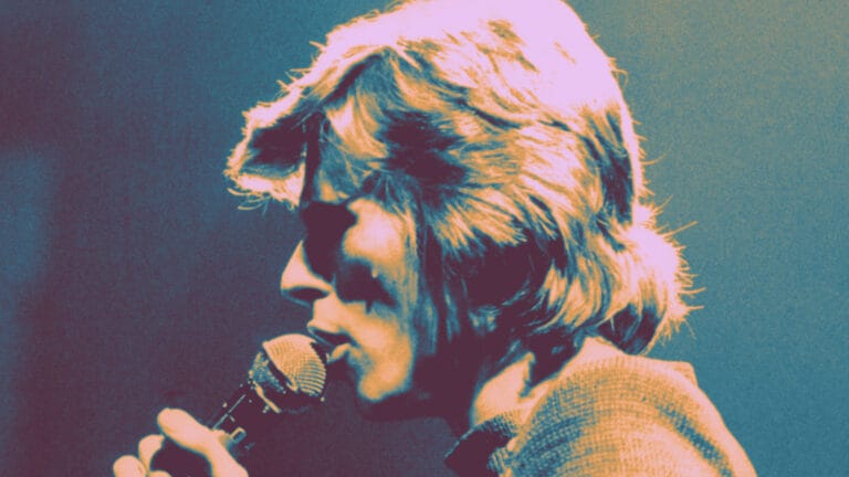 david bowie onstage in 1974, color added