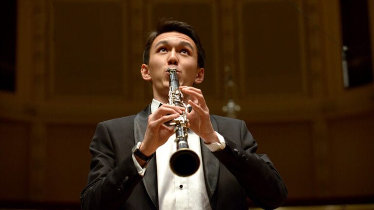 Louis Auxenfans performs clarinet onstage