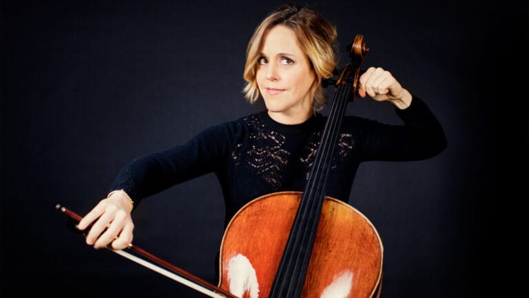 Sol Gabetta poses with a cello and a bow