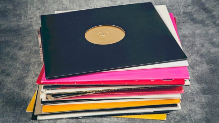 a multicolored stack of vinyl records