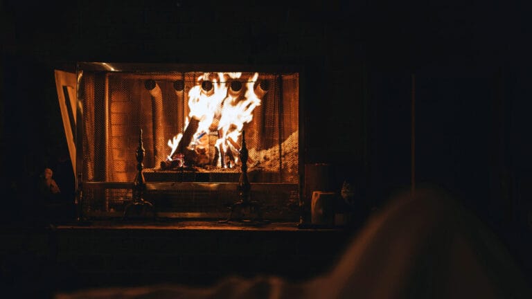a cozy looking fireplace at night