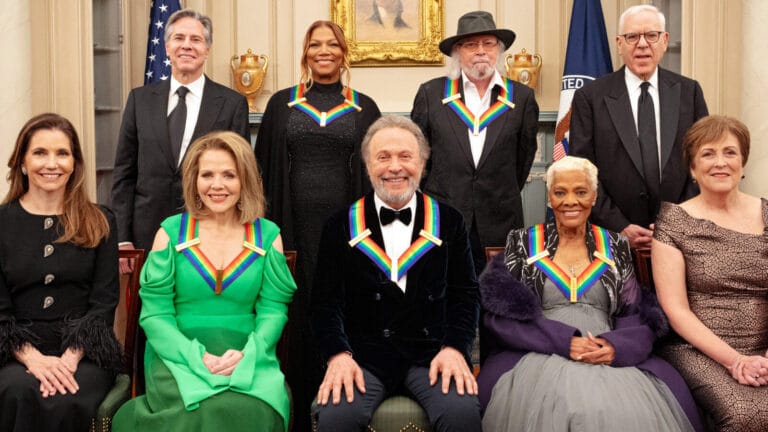 A group portrait of the 2023 Kennedy Center honorees — Queen Latifah, Barry Gibb, Renée Fleming, Billy Crystal, and Dionne Warwick —alongside US government officials and arts administrators