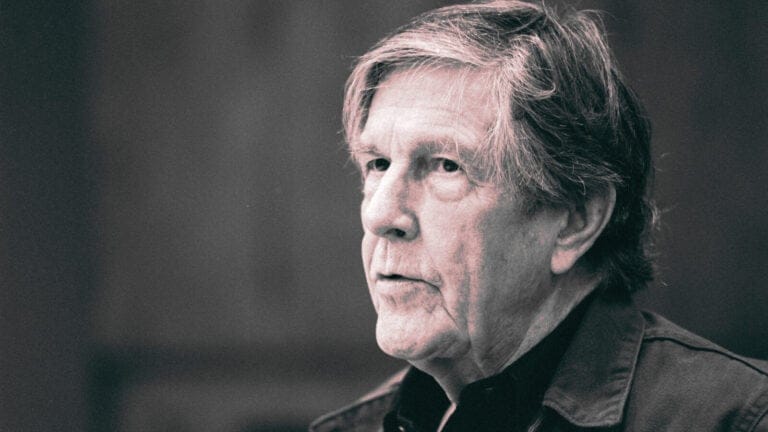 composer John Cage looks thoughtful