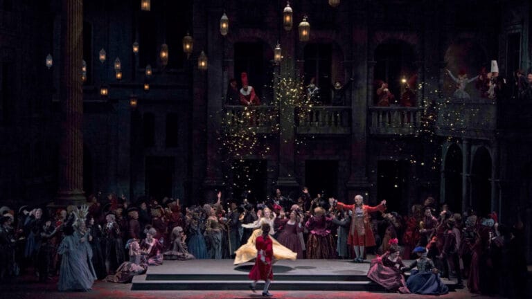 a lively dance scene with period sets and costumes for Gounod's Romeo et Juliette
