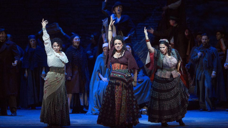 Shirin Eskandani as Mercédès, Clémentine Margaine in the title role, and Danielle Talamantes as Frasquita in Bizet's Carmen. Photo by Marty Sohl/Metropolitan Opera.