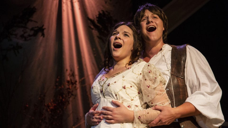 The titular couple (Angela Born as Patience, Jenna Schroer as Sarah) embraces in Third Eye Theatre Ensemble's production of Patience and Sarah. (Photo: Clint Funk)