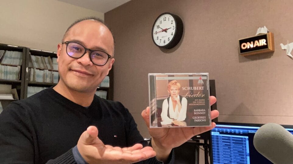 Oliver Camacho holding a CD: Schubert Lieder by Barbara Bonney and Geoffrey Parsons