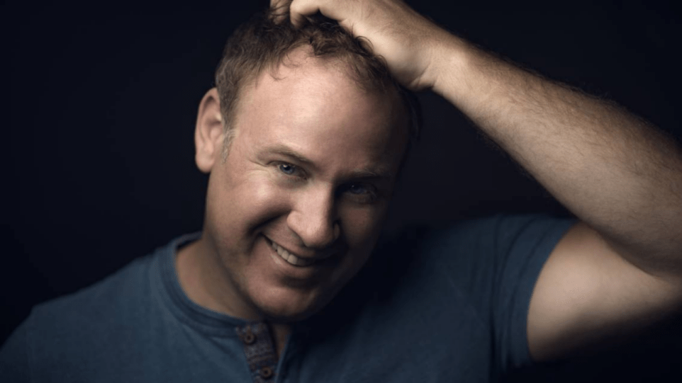 Lucas Meachem portrait, scratching head