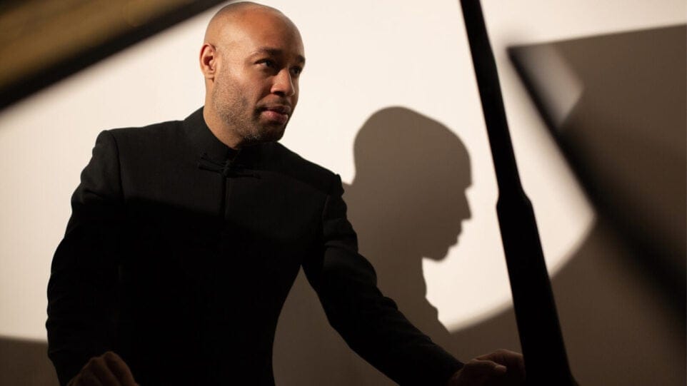 Aaron Diehl poses with a piano