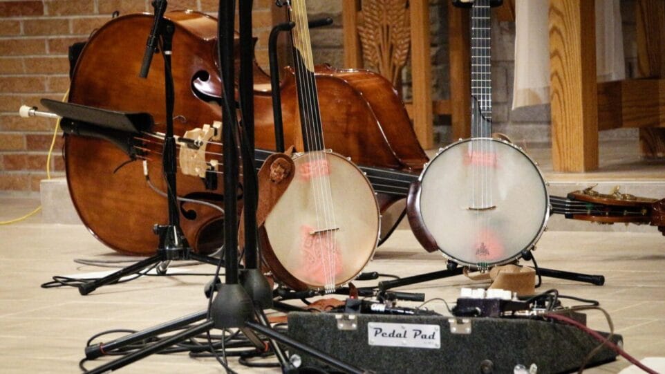 two banjos in front of a bass fiddle