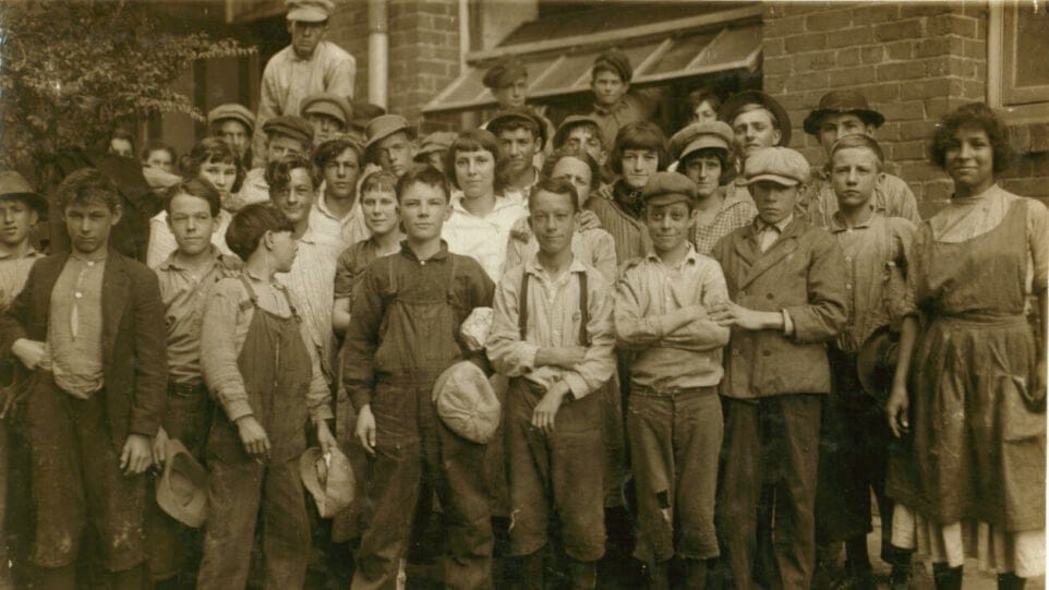 large group of child laborers in work clothes