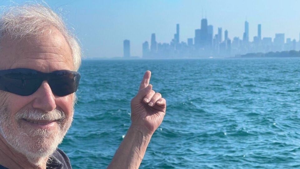 Corky Siegel poses with the Chicago Skyline