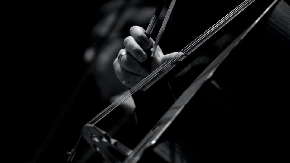 Black and White picture of someone playing Cello