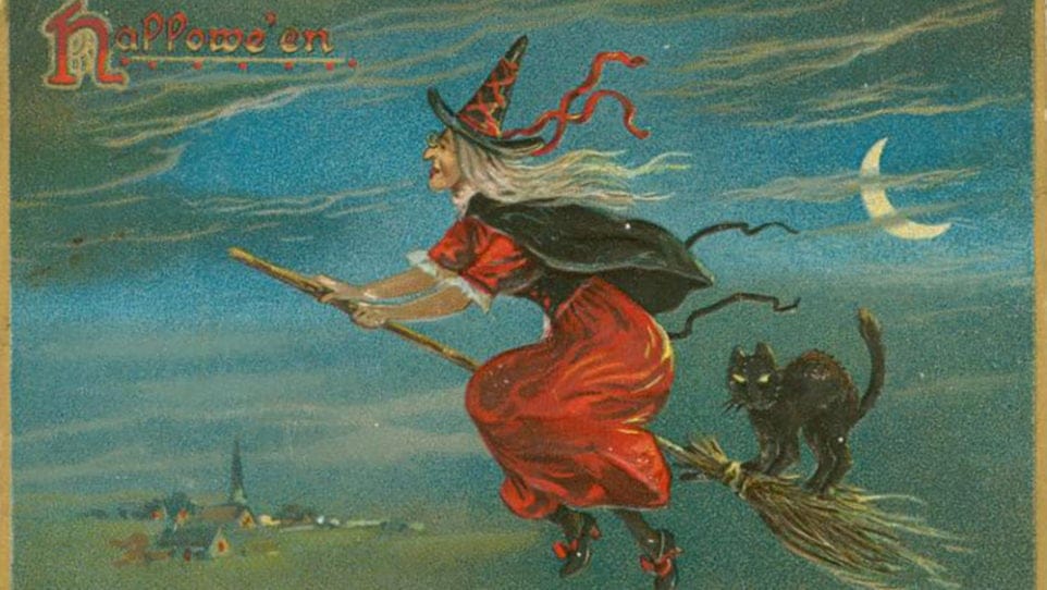 vintage greeting card with witch on a broomstick