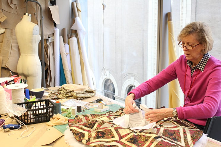 Debra Schoell, in her 10th season with Joffrey, works on a costume for the new "Nutcracker"