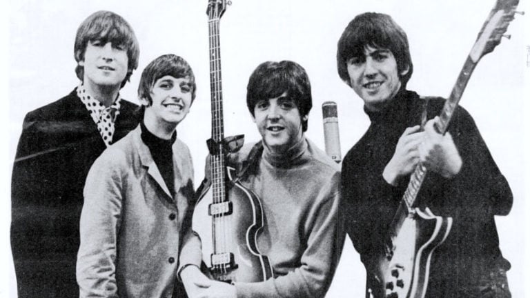 The Beatles, 1965, pose together with their instruments
