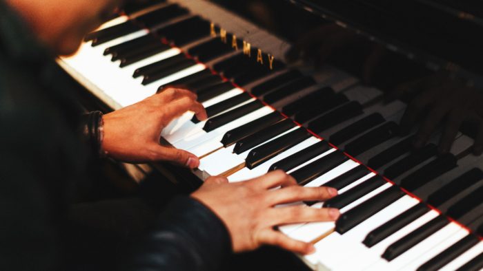 Piano being played by a pianist