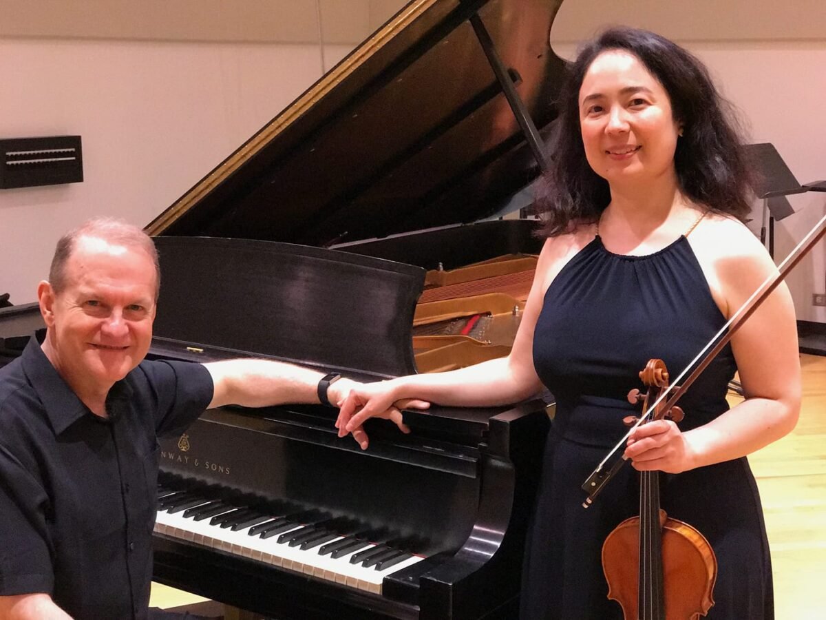 Dennis Moore at the piano with his partner Sara Su Jones in WFMT's Levin Performance Studio color photo piano violin recording studio WFMT radio