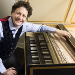 Jory Vinikour poses with a harpsichord