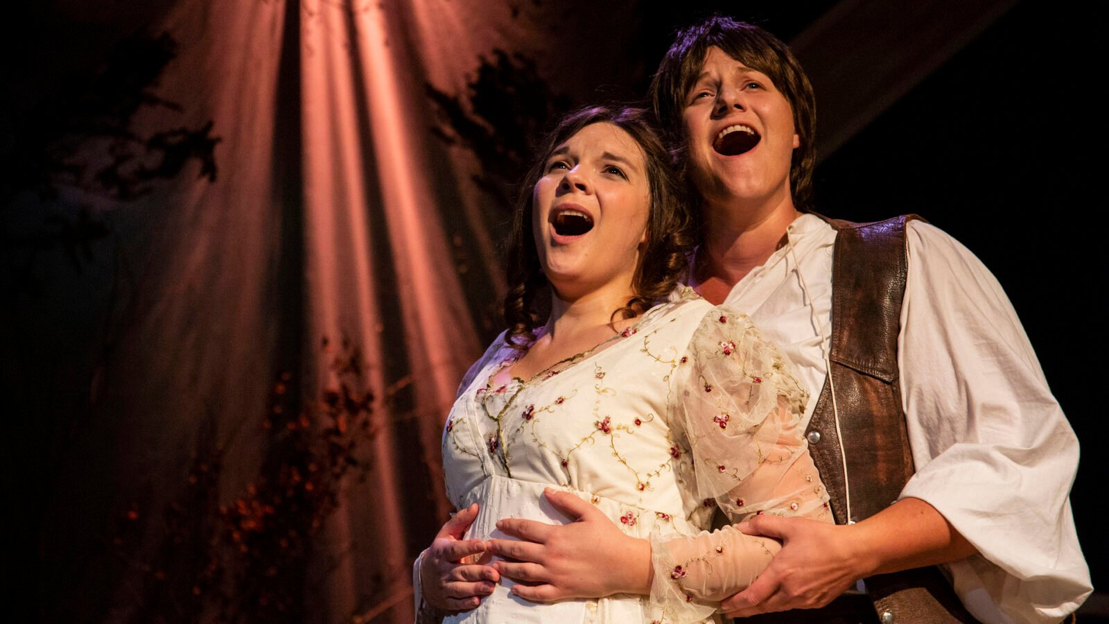 The titular couple (Angela Born as Patience, Jenna Schroer as Sarah) embraces in Third Eye Theatre Ensemble's production of Patience and Sarah. (Photo: Clint Funk)