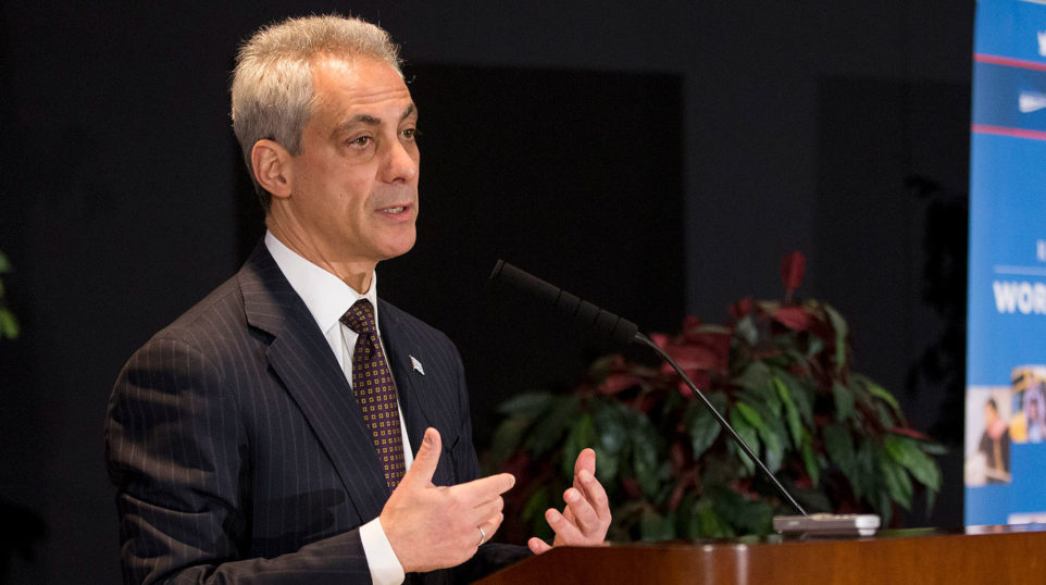 Rahm Emanuel speaking at a lectern