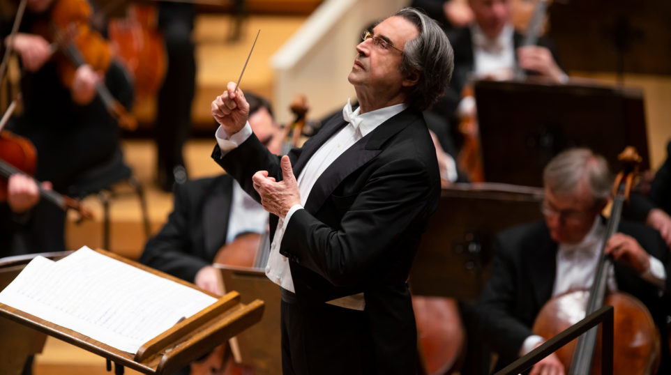Man in white tie and tails conducting