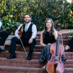 Kontras Quartet poses outside on a stairwell