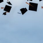 Graduation caps in the sky