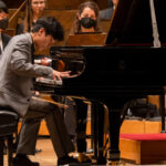 pianist Noah Kim onstage at symphony center