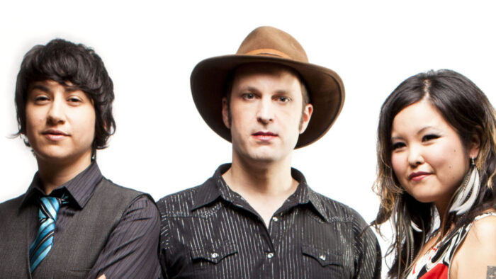 woman in suit, man in hat, woman in sundress