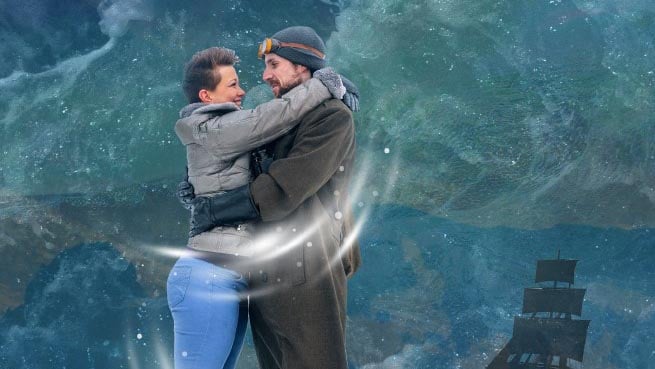 woman and man embrace in a storm at sea