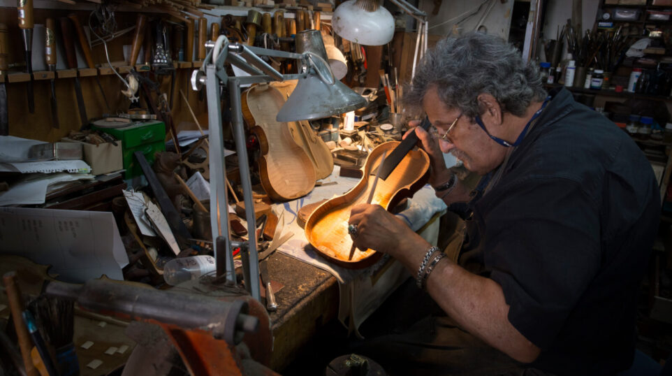 Amnon Weinstein at work repairing a violin