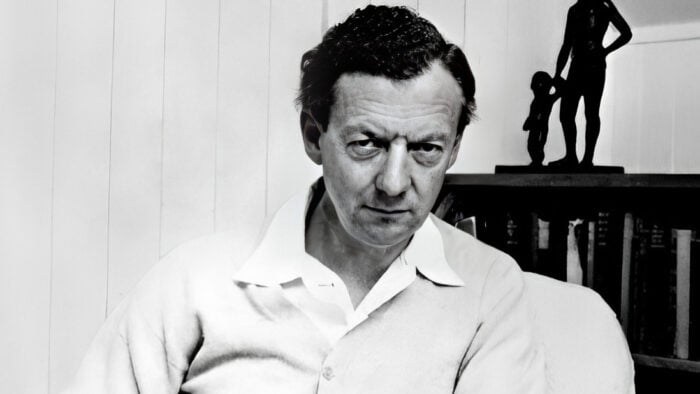 Benjamin Britten sitting in a chair